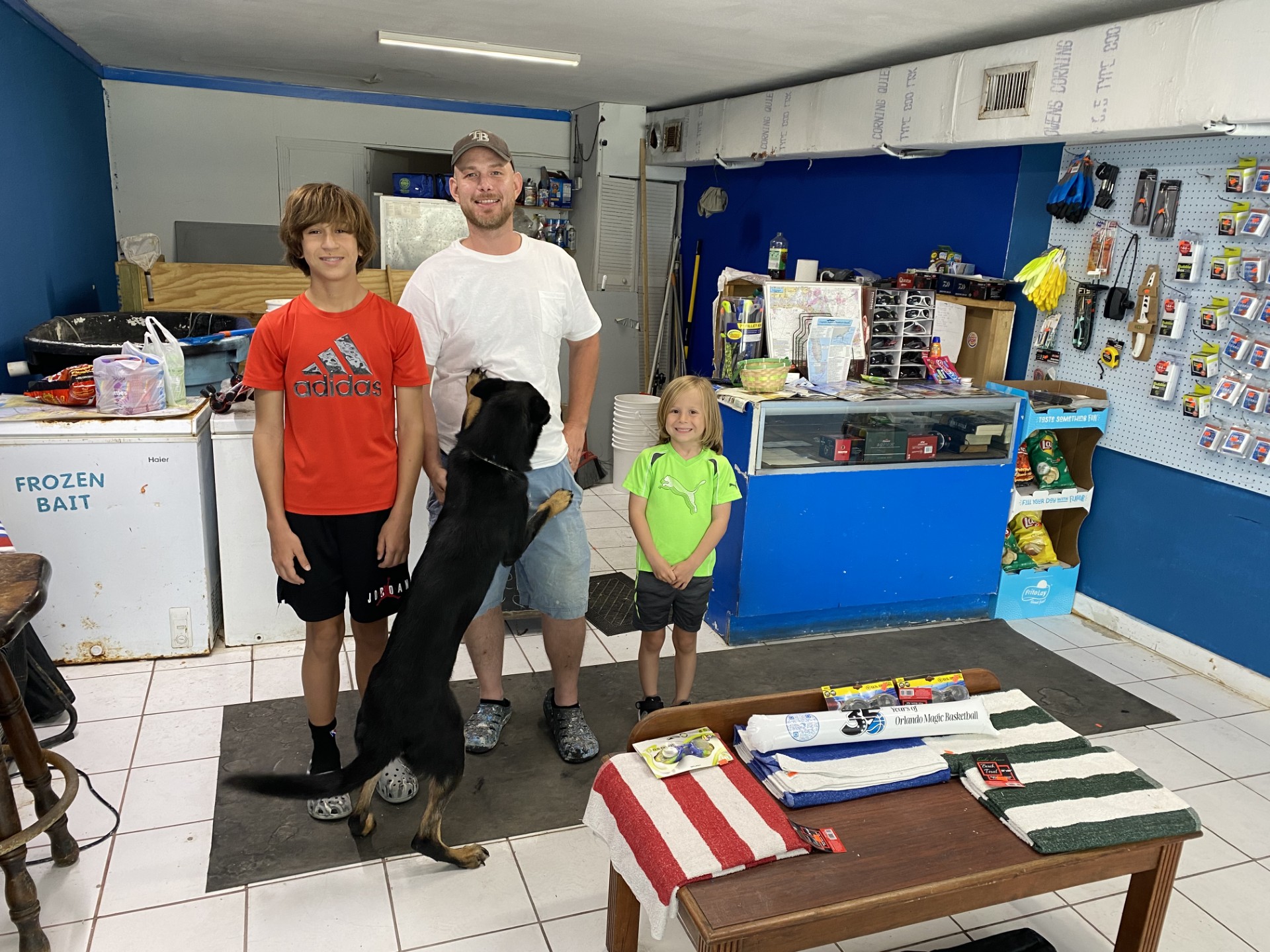 Family and staff inside Pat's bait and tackle shop